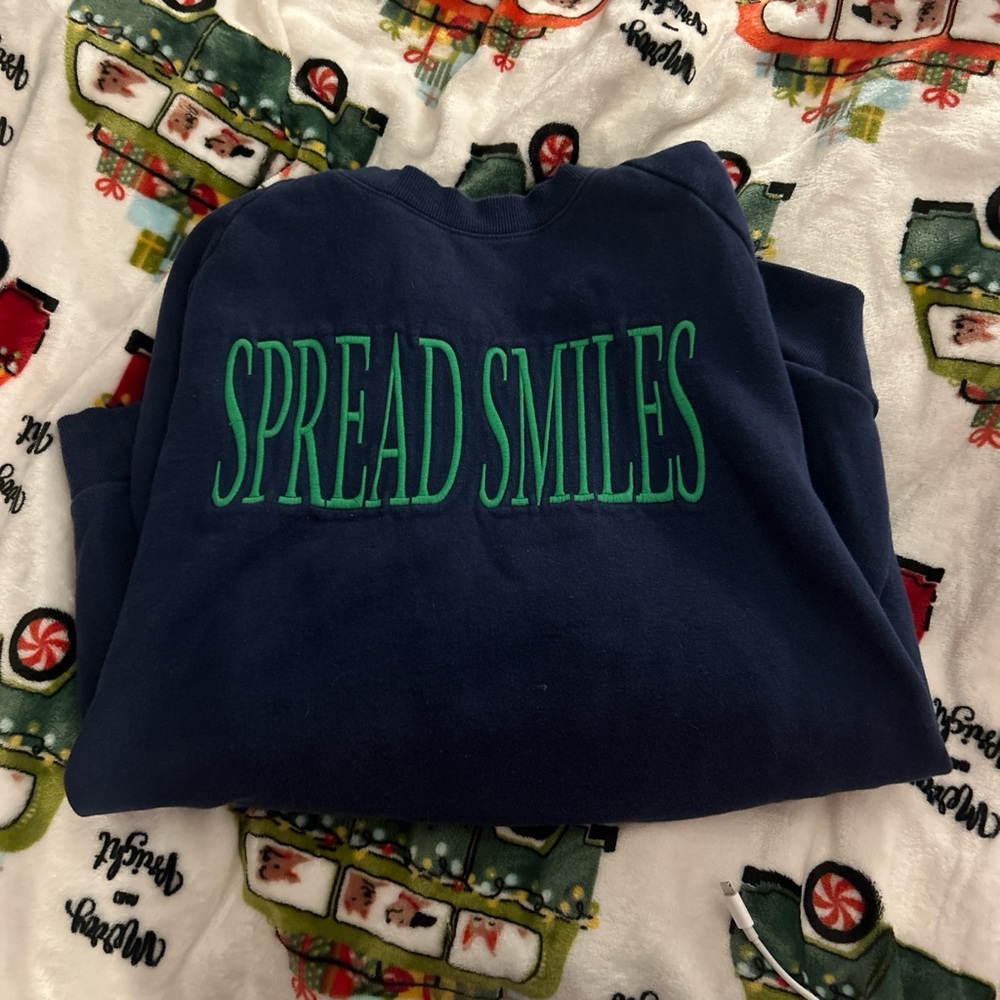 Navy Sweatshirt with Green 'Spread Smiles' Embroidery